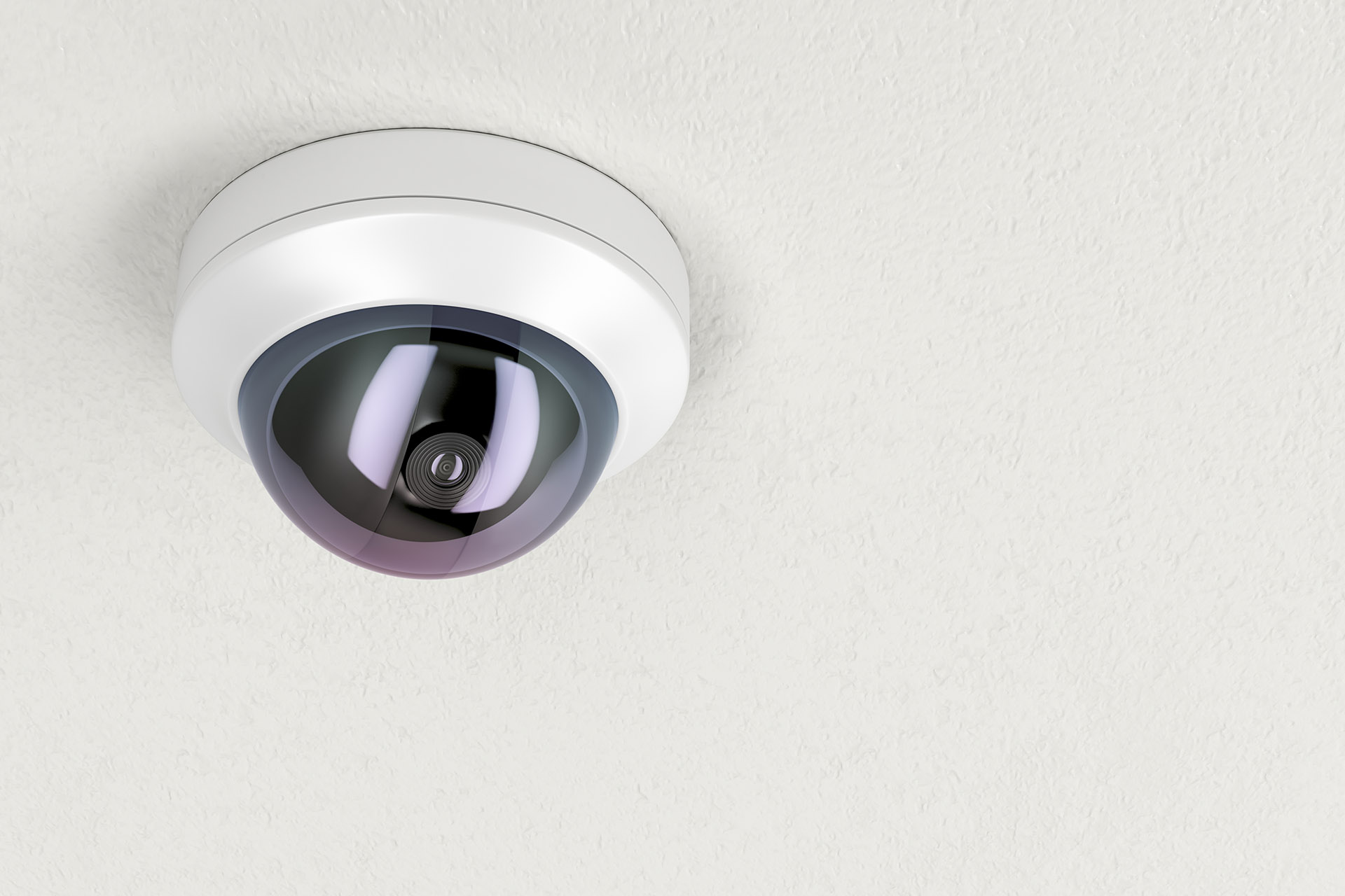 Surveillance Camera Attached on White Ceiling